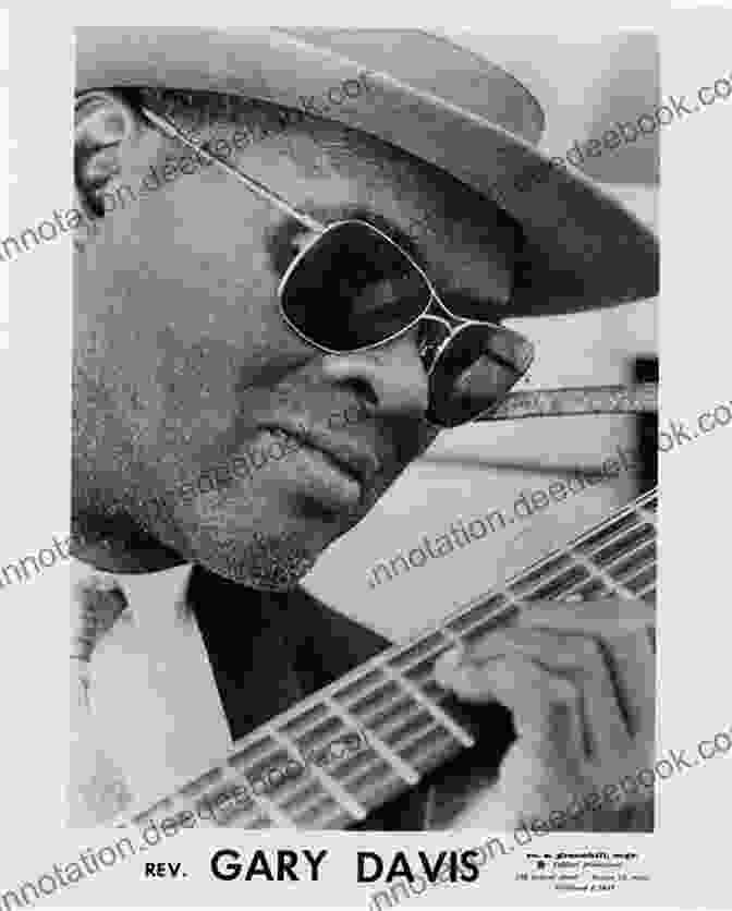 A Black And White Portrait Of Richard Davis, A Blues Guitarist With A Warm Smile And Furrowed Brow, Holding A Guitar. Blues Guitar Ensembles Richard Davis